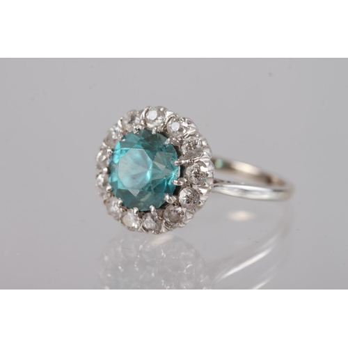 380 - A platinum dress ring set blue zircon and collar of diamonds, size N, 4.3g gross