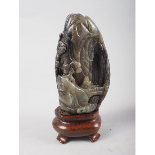 114 - A Chinese carved hardstone boulder, decorated buildings, trees and a figure, on hardwood stand, 4