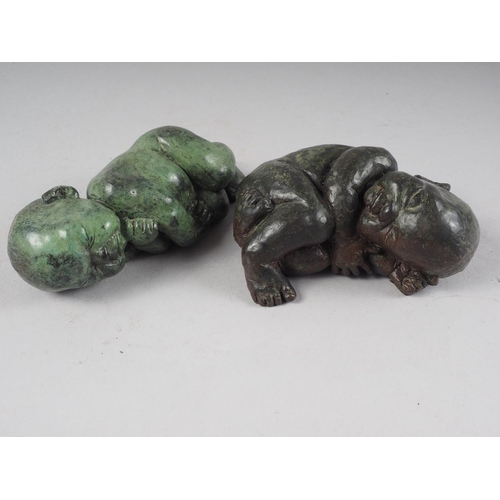 155 - Two cast bronze and lead filled model new born babies, largest 5