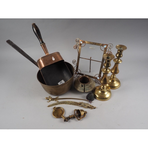 160 - A 19th century copper scoop with turned wood handle, a brass saucepan, a pair of candlesticks, a har... 