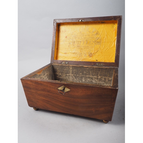 167 - A 19th century mahogany coffee caddy with silver foil lining and original company label inside, on b... 