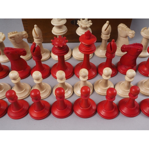 187 - A turned, carved and stained bone chess set, the king 2 5/8