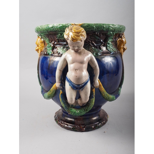 20 - A  majolica two-handle vase with putto and swags, 10