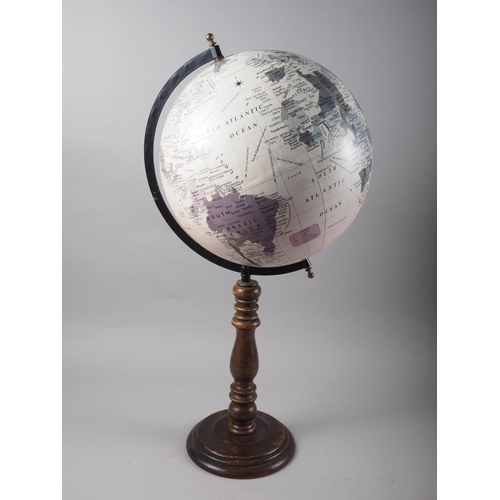 212 - A 20th century terrestrial globe, on turned hardwood stand, 26