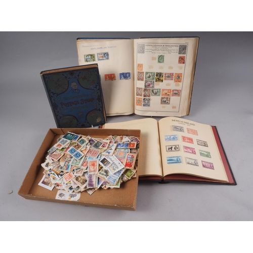 251 - A Coronation stamp album, containing stamps from around the world, two similar stamp albums and a qu... 