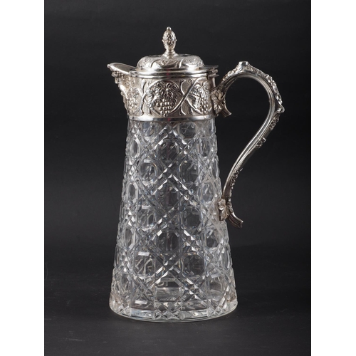 259 - A cut glass and silver plate mounted claret jug with grape and vine decoration and mask spout, 11