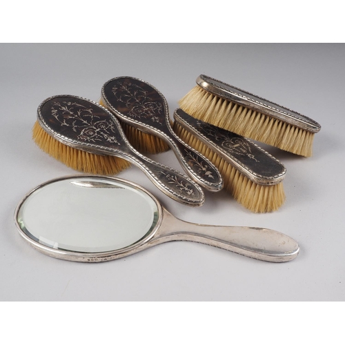 275 - A silver and tortoiseshell pique six-piece dressing table set