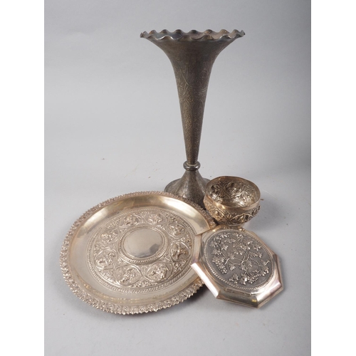 282 - An Oriental embossed card tray, a smaller similar bowl, a Chinese compact, fitted mirror, and a trum... 