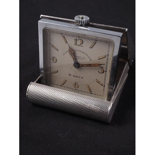 286 - A Goldsmiths & Silversmiths engine turned silver cased travelling clock 62mm h x 42mm w x 13mm d