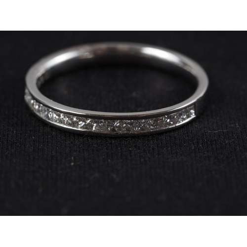 304 - A platinum half-eternity hoop set diamonds, 22 points approx, size N