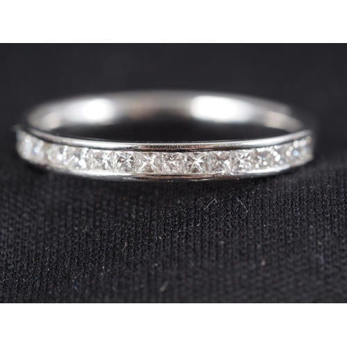 304 - A platinum half-eternity hoop set diamonds, 22 points approx, size N