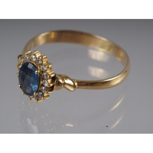 332 - A yellow metal ring set oval mixed cut Sri Lankan sapphire with collar of diamonds, sapphire .9ct ap... 