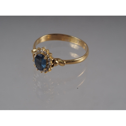 332 - A yellow metal ring set oval mixed cut Sri Lankan sapphire with collar of diamonds, sapphire .9ct ap... 