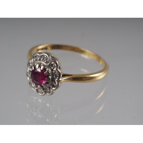 347 - An 18ct gold dress ring set central ruby, .32ct approx, and collar of diamonds, 3g gross, size 0 1/2