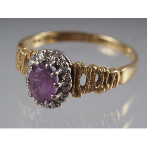 360 - An 18ct gold dress ring set amethyst with collar of diamonds, on textured shoulders, 3.8g gross, siz... 