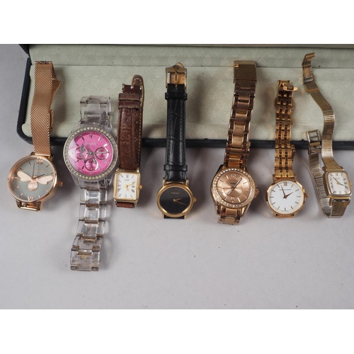 376 - A lady's Gucci wristwatch with leather strap, a lady's Fossil watch with brilliant set bezel, a simi... 