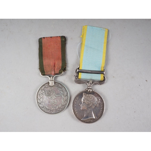 384 - A Victorian 1854 Crimea War medal with Sebastopol bar to W Holt J Troop Horse Artillery and a Turkis... 