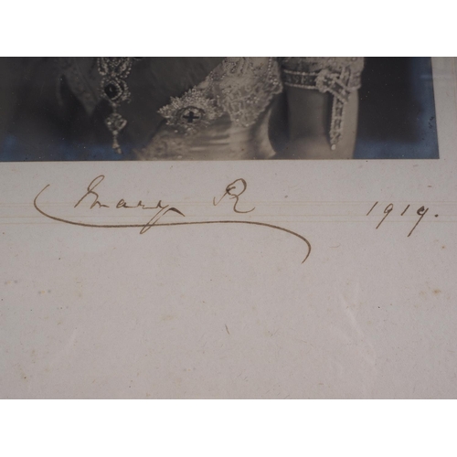 397 - A pair of signed portrait photographs of King George V and Queen Mary, dated 1919, in white ornate f... 