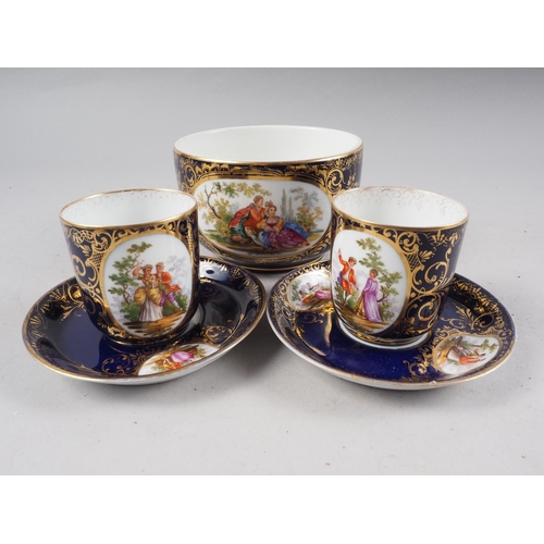 47 - A pair of Vienna cabinet cups and saucers, decorated panels with figures in a landscape on a blue gr... 