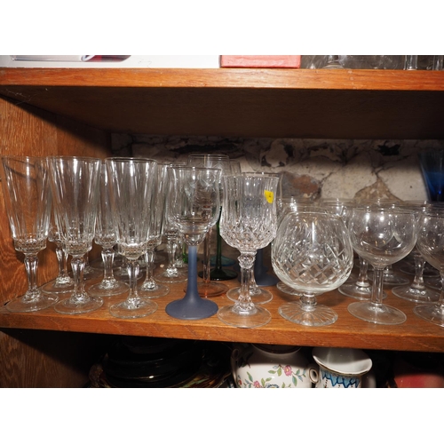 53 - A quantity of pedestal glasses, including fourteen champagne flutes, twelve wines, two tumblers and ... 