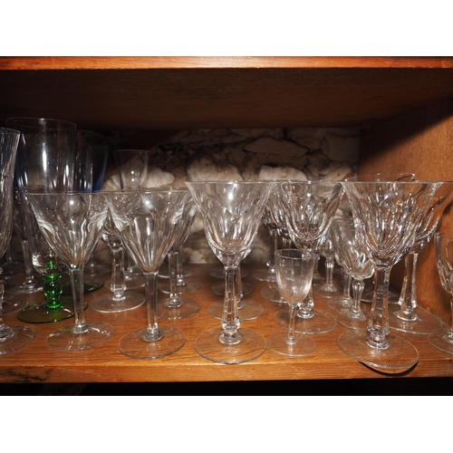 53 - A quantity of pedestal glasses, including fourteen champagne flutes, twelve wines, two tumblers and ... 