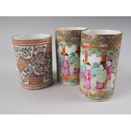 83 - A pair of Canton enamel decorated spill vases with figure panels, 4 3/4