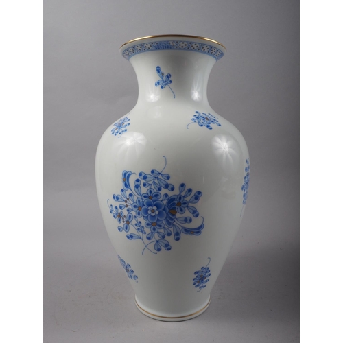 9 - A Herend porcelain blue and gilt floral decorated vase, 12 1/2