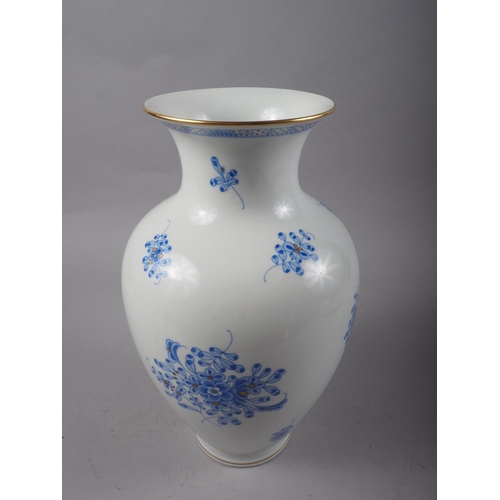 9 - A Herend porcelain blue and gilt floral decorated vase, 12 1/2