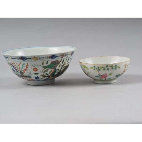 91 - A Chinese bowl with polychrome dragon, phoenix and leaf decoration, 6 1/4