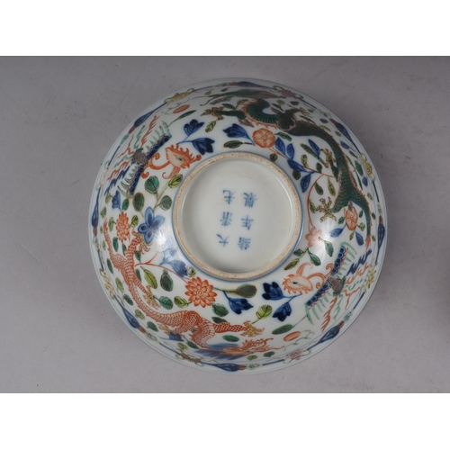 91 - A Chinese bowl with polychrome dragon, phoenix and leaf decoration, 6 1/4