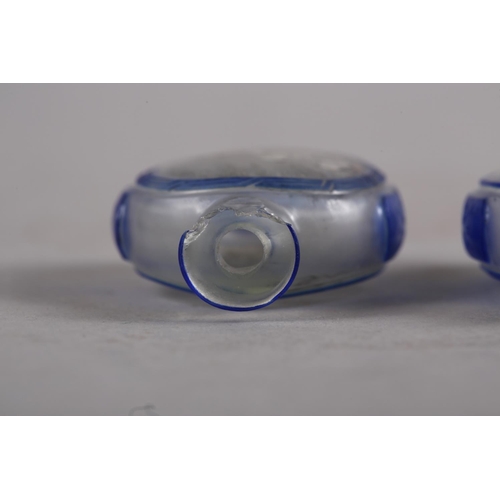 105 - Two Chinese blue and clear glass snuff bottles, 2 1/2