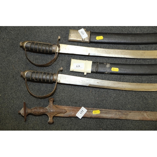 177 - Two replica cutlasses in scabbards, blades approx 31