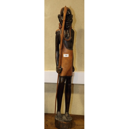 220 - An African carved ebony Masai warrior figure, 37