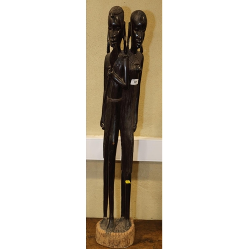 221 - An African carved ebony Masai couple, 37