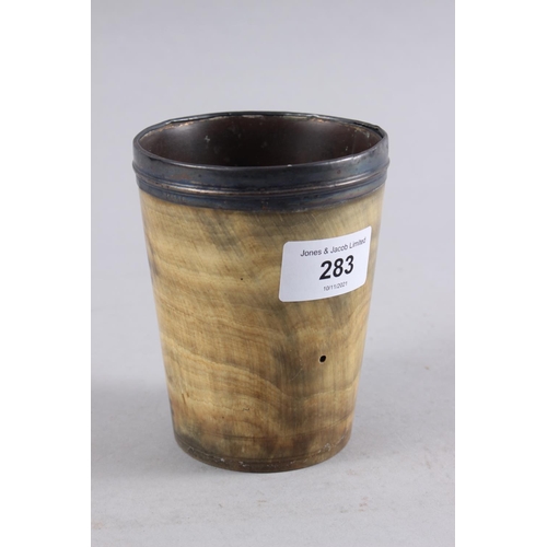 283 - An antique horn beaker with Georgian silver mount