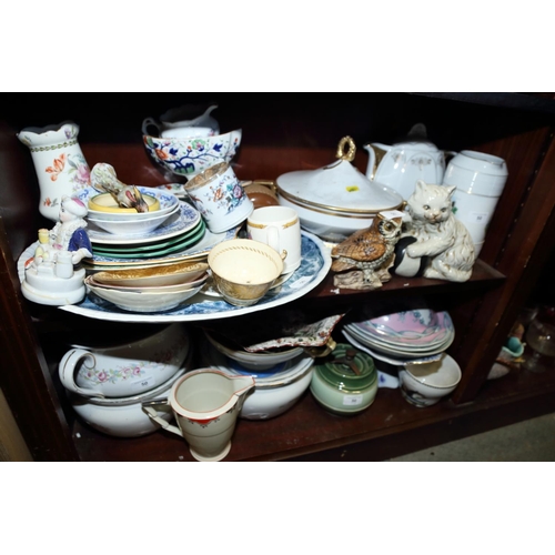 50 - A quantity of ceramics, including three chamber pots, a meat platter, tureens, mugs, a model of an o... 