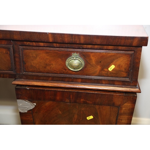 531 - A William IV figured mahogany double pedestal sideboard, fitted three drawers with ring handles over... 