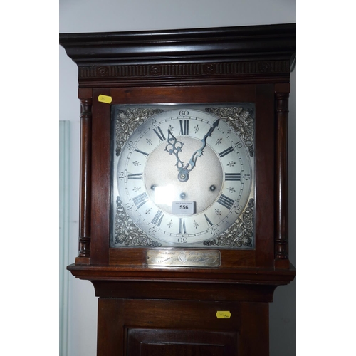 556 - An Edwardian mahogany longcase clock with striking and chiming movement and silvered dial, 73