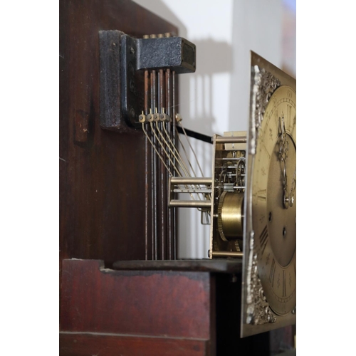 556 - An Edwardian mahogany longcase clock with striking and chiming movement and silvered dial, 73