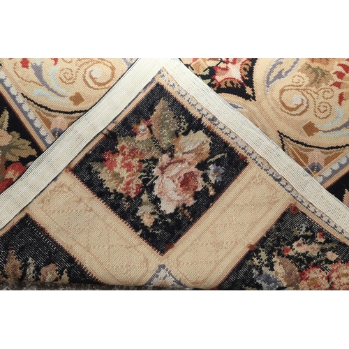 667 - An Aubusson type rug with floral panel designs, 72