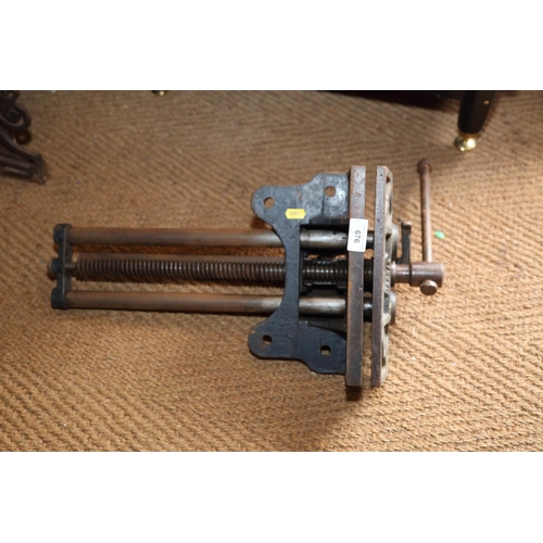 676 - A Woden cast iron vice