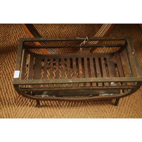 677 - A cast iron fire grate and a fire back with fleur-de-lys decoration