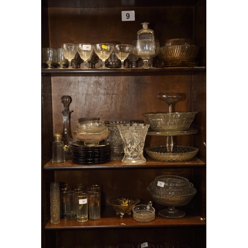 51 - An assortment of glassware, including pedestal glasses, cut glass bowls, a decanter, eleven smokey g... 