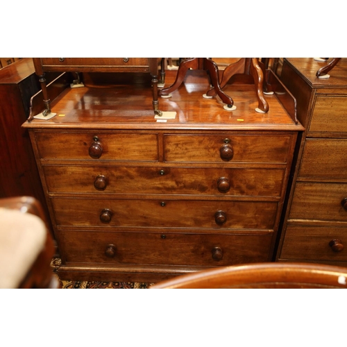 548 - A 19th century mahogany chest of two short and three long drawers with gallery over, on block base, ... 