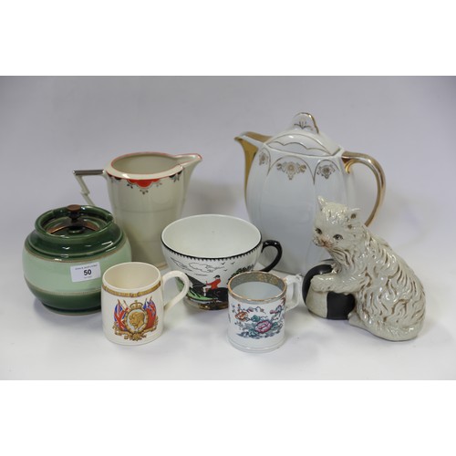 50 - A quantity of ceramics, including three chamber pots, a meat platter, tureens, mugs, a model of an o... 