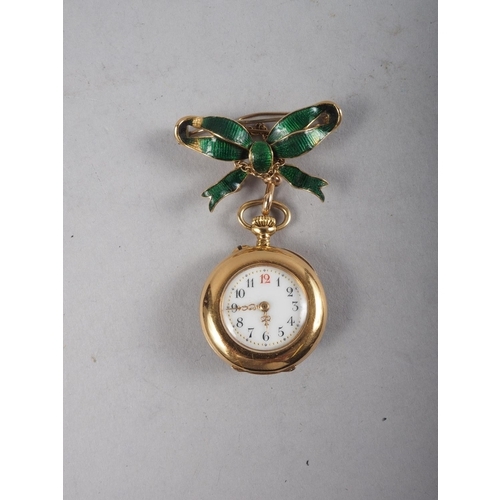 377 - A 19th century French yellow metal and enamelled pendant watch, on a bow brooch, by LeRoy and Fils, ... 