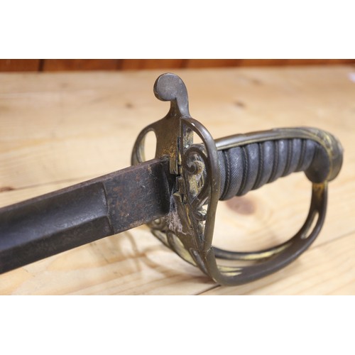 193 - A Wilkinson 1822 pattern Infantry Officer's sword with folding guard section and coat of arms to bla... 