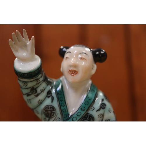 110 - A Chinese porcelain famille verte enamel decorated figure group, 5 1/4