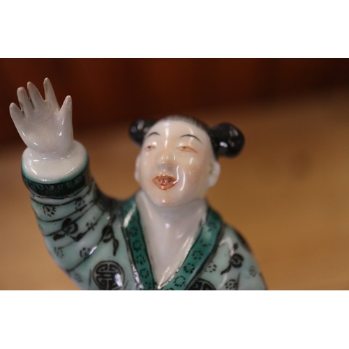 110 - A Chinese porcelain famille verte enamel decorated figure group, 5 1/4