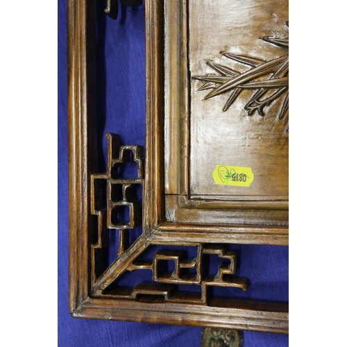 123 - A pair of Chinese carved hardwood panels, studies of bamboo, 23